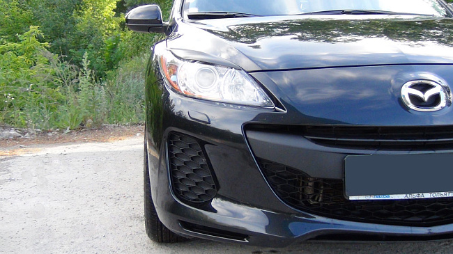 картинка Mazda 3 (седан, хэтчбэк) 2010—2013 Накладки на передние фары (реснички) компл.-2 шт. магазин  StreetTuning 